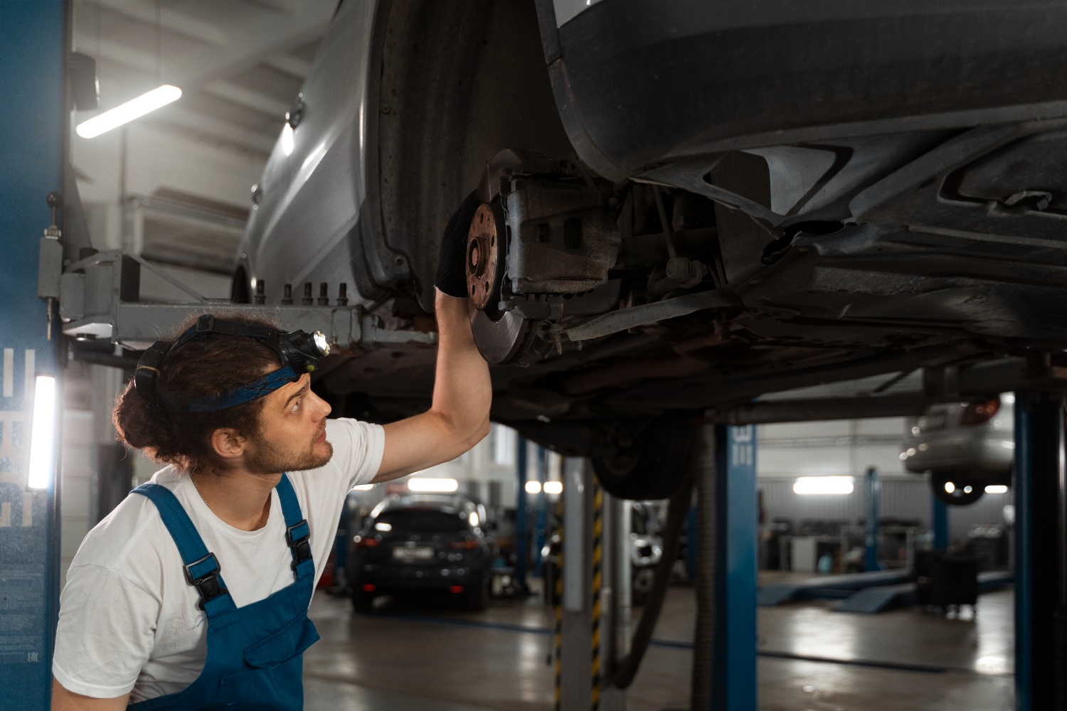 Volkswagen Garage Basingstoke Volkswagen garage in Basingstoke inspecting car with specialist mechanics.